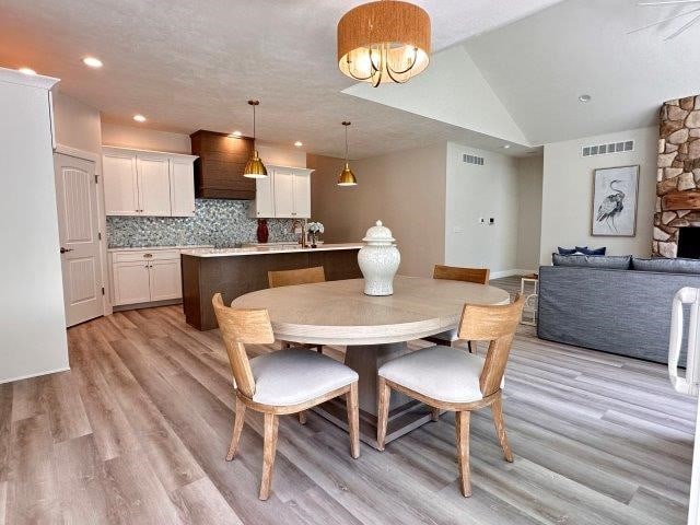 4655 Elsie Rd Unit 1, Erie, PA 16511 - dining space featuring light wood-style flooring, lofted ceiling, and recessed lighting