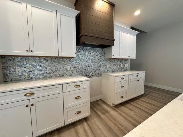 4655 Elsie Rd Unit 1, Erie, PA 16511 - kitchen featuring light countertops, white cabinetry, light wood finished floors, and recessed lighting