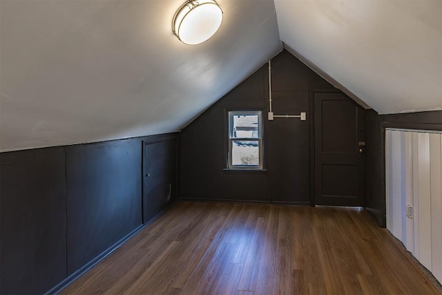 bonus room with vaulted ceiling and wood finished floors