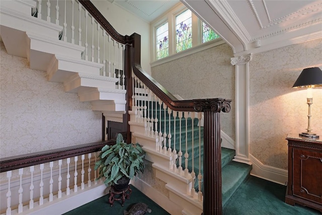 stairway with ornamental molding, carpet floors, and a towering ceiling