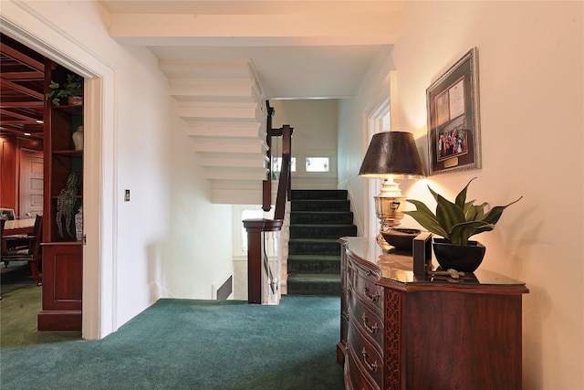 corridor featuring dark colored carpet