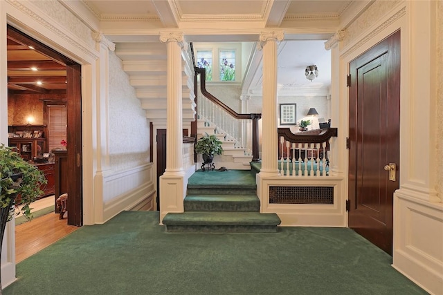 interior space featuring carpet floors, decorative columns, and crown molding