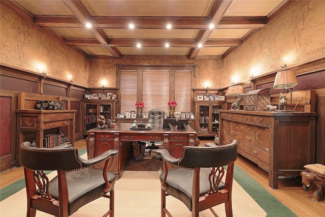 bar with beamed ceiling, light hardwood / wood-style floors, coffered ceiling, and ornamental molding