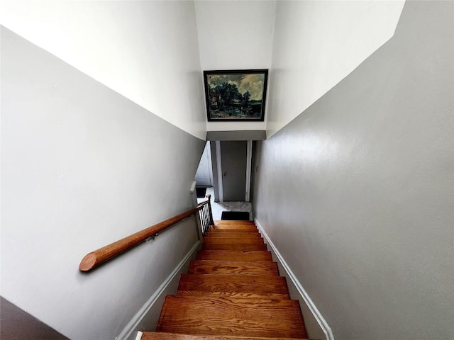 stairs with hardwood / wood-style floors