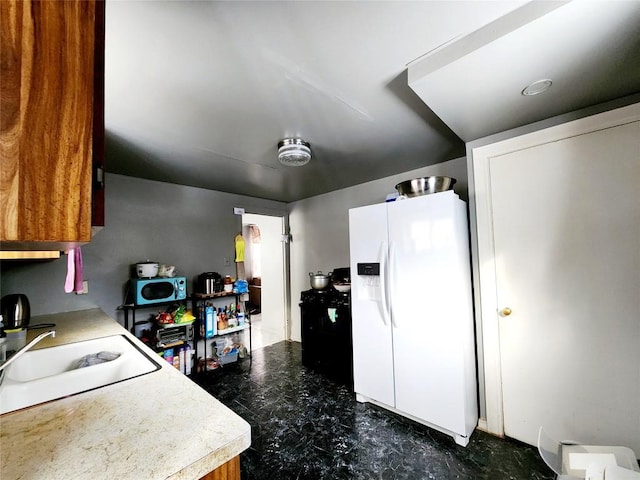 kitchen with white appliances and sink