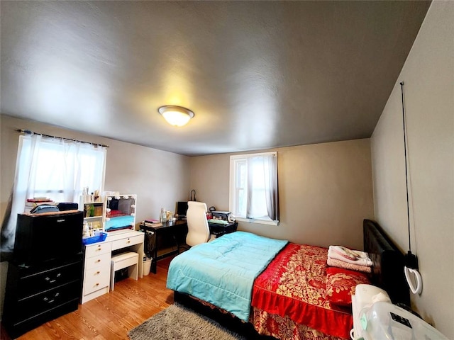 bedroom featuring light wood-type flooring