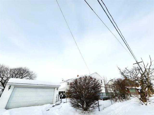 view of front of property featuring an outbuilding and a garage