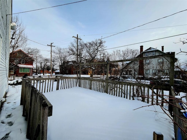 view of yard layered in snow