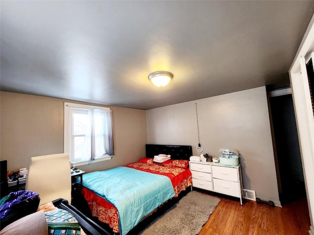 bedroom featuring wood-type flooring