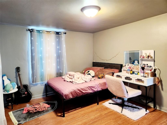 bedroom with light hardwood / wood-style flooring