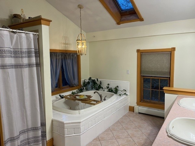 bathroom featuring a baseboard radiator, vaulted ceiling with skylight, a sink, tile patterned flooring, and a bath