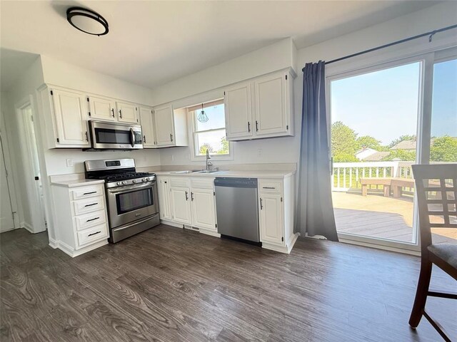 816 E Grandview Blvd, Erie, PA 16504 - kitchen with stainless steel appliances, light countertops, white cabinetry, and dark wood-style floors