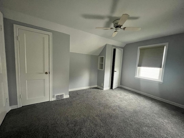 additional living space with vaulted ceiling, a ceiling fan, baseboards, carpet flooring, and visible vents