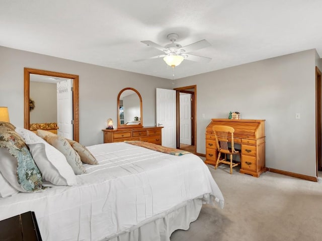 bedroom featuring baseboards, ceiling fan, and light colored carpet