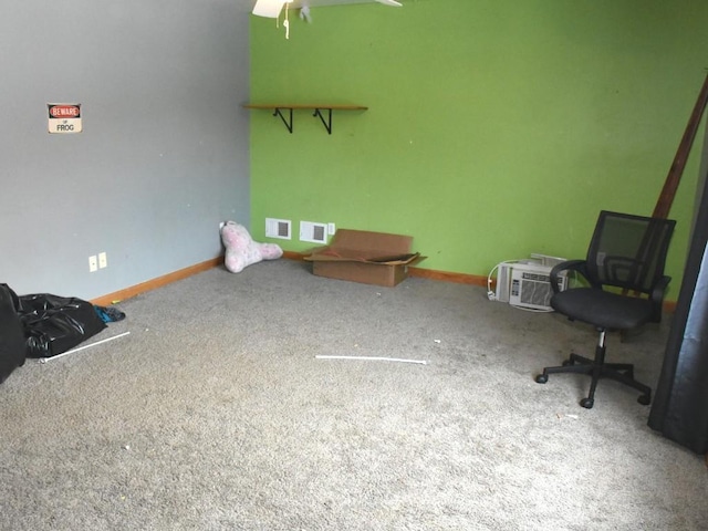 interior space with baseboards, visible vents, and carpet flooring