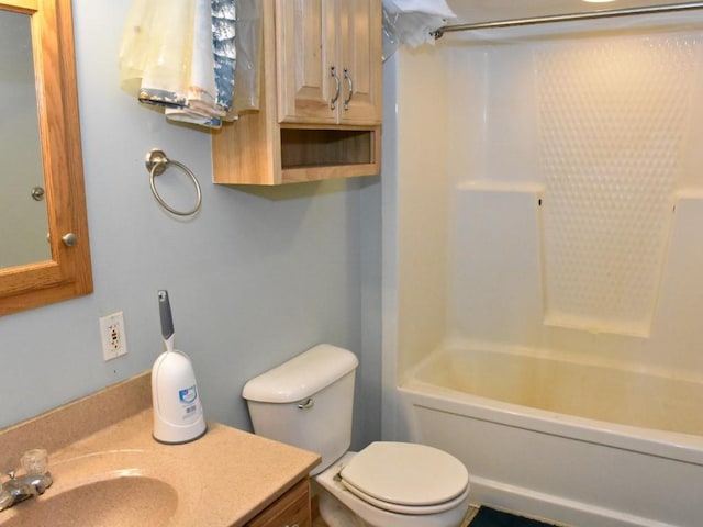 bathroom featuring shower / bathing tub combination, vanity, and toilet