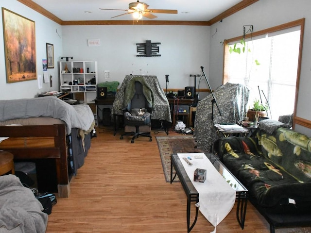 bedroom with light wood-type flooring and ornamental molding