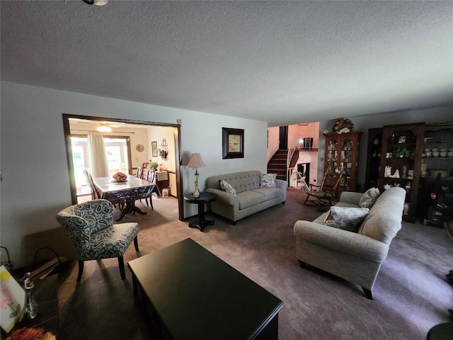 living room with carpet and a textured ceiling