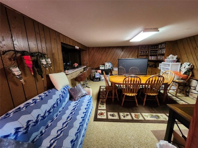 dining area with wooden walls