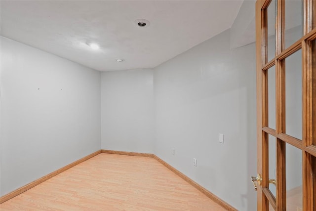 spare room with light hardwood / wood-style flooring