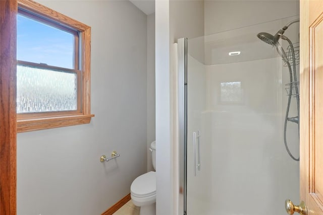 bathroom with toilet and a shower