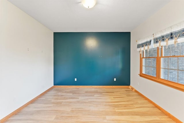 spare room featuring light hardwood / wood-style floors