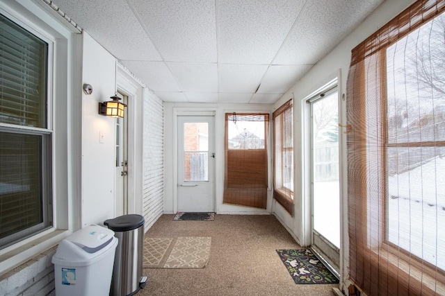 sunroom featuring a healthy amount of sunlight and a paneled ceiling