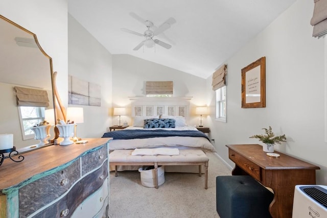 bedroom with vaulted ceiling, carpet flooring, a ceiling fan, and multiple windows