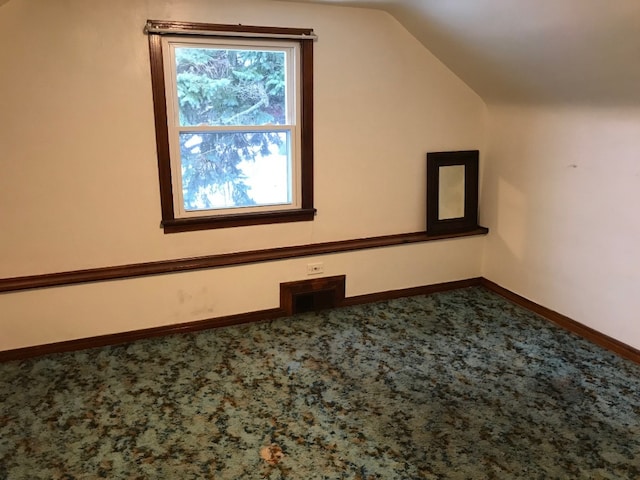 additional living space with vaulted ceiling