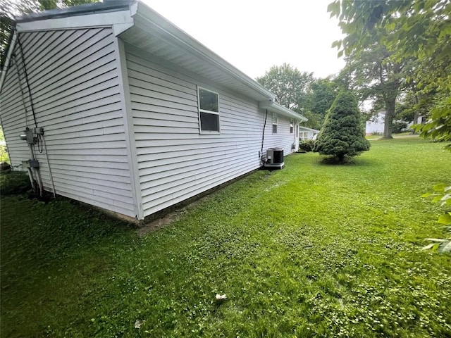 11694 Oakfield Rd, Conneaut Lake, PA 16316 - view of side of property with a central AC unit and a lawn