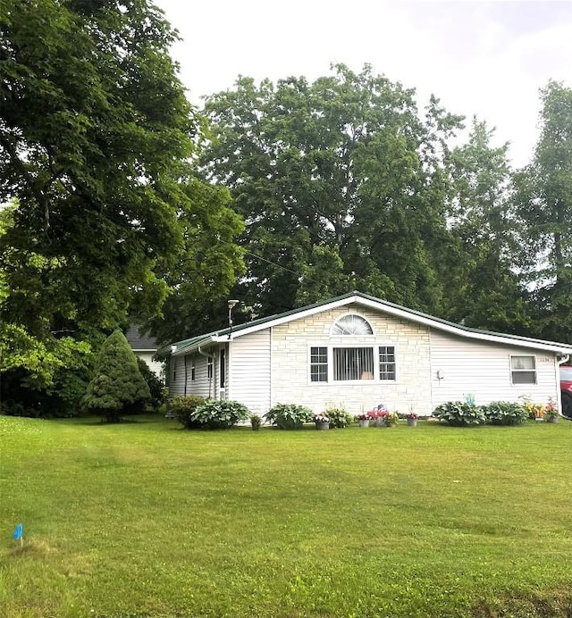 11694 Oakfield Rd, Conneaut Lake, PA 16316 - view of property exterior with a lawn and view of scattered trees