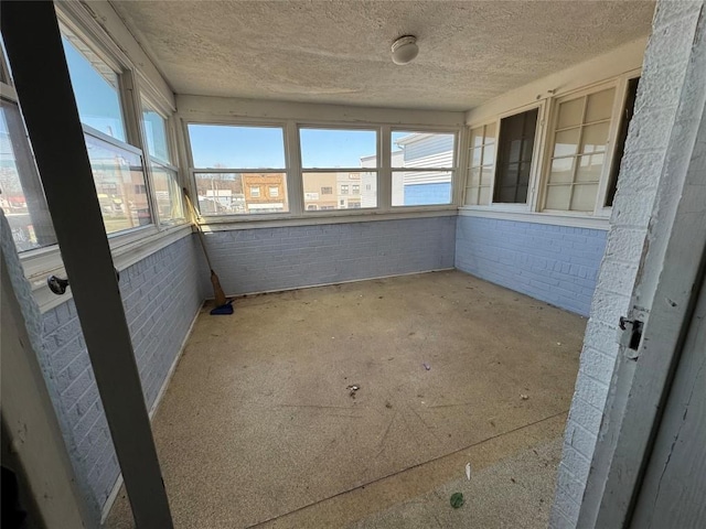 unfurnished sunroom with a healthy amount of sunlight