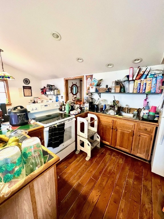 13478 Old Lake Rd Unit 63, East Springfield, PA 16411 - kitchen featuring electric stove, dark wood finished floors, brown cabinets, vaulted ceiling, and recessed lighting