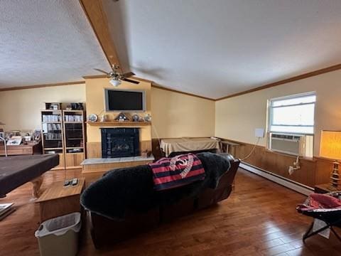 living room with a fireplace, vaulted ceiling with beams, wood-type flooring, cooling unit, and baseboard heating