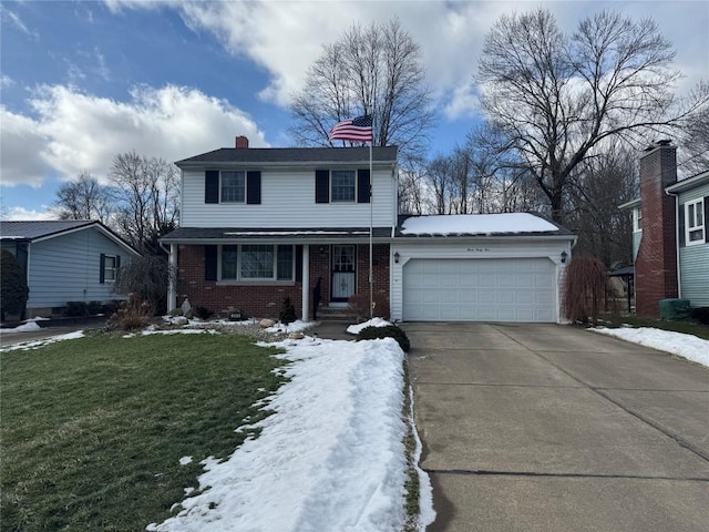 view of front of house with a garage and a lawn