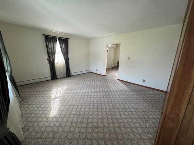 unfurnished room with a baseboard radiator