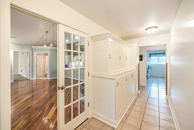 8730 Peffer Rd, Fairview, PA 16415 - hallway featuring baseboards and light tile patterned flooring