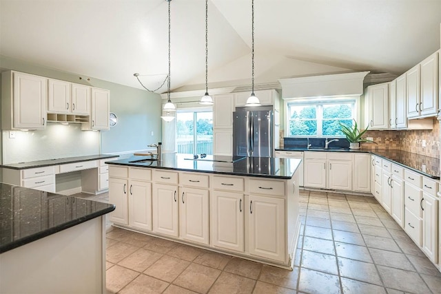 8730 Peffer Rd, Fairview, PA 16415 - kitchen featuring freestanding refrigerator, lofted ceiling, a sink, healthy amount of natural light, and backsplash