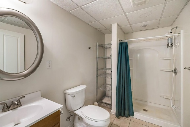 8730 Peffer Rd, Fairview, PA 16415 - full bathroom featuring vanity, a shower with shower curtain, toilet, tile patterned floors, and a drop ceiling