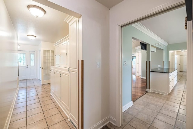 8730 Peffer Rd, Fairview, PA 16415 - hallway with light tile patterned floors, baseboards, and crown molding