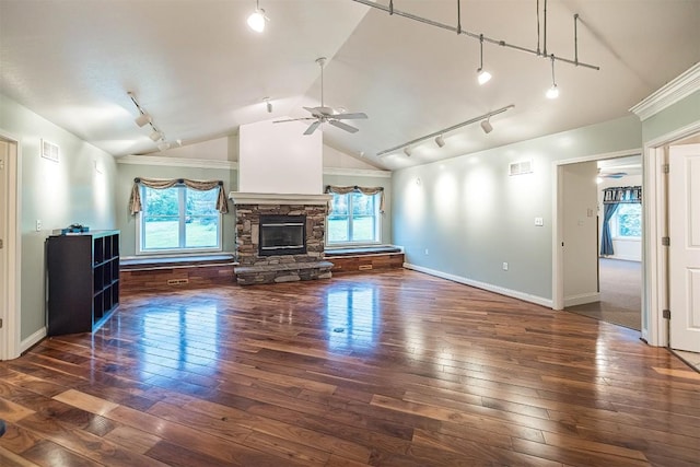 8730 Peffer Rd, Fairview, PA 16415 - unfurnished living room featuring track lighting, lofted ceiling, ceiling fan, healthy amount of natural light, and hardwood / wood-style floors