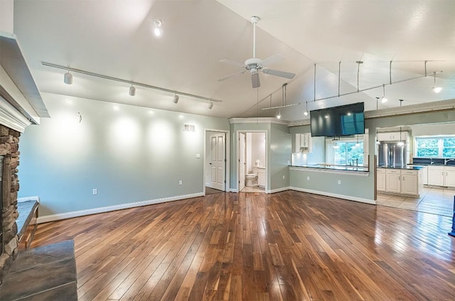 8730 Peffer Rd, Fairview, PA 16415 - unfurnished living room with track lighting, a ceiling fan, hardwood / wood-style floors, and lofted ceiling