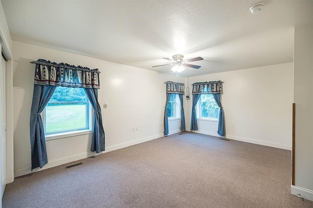 8730 Peffer Rd, Fairview, PA 16415 - carpeted spare room featuring ceiling fan, a smoke detector, baseboards, and a textured ceiling