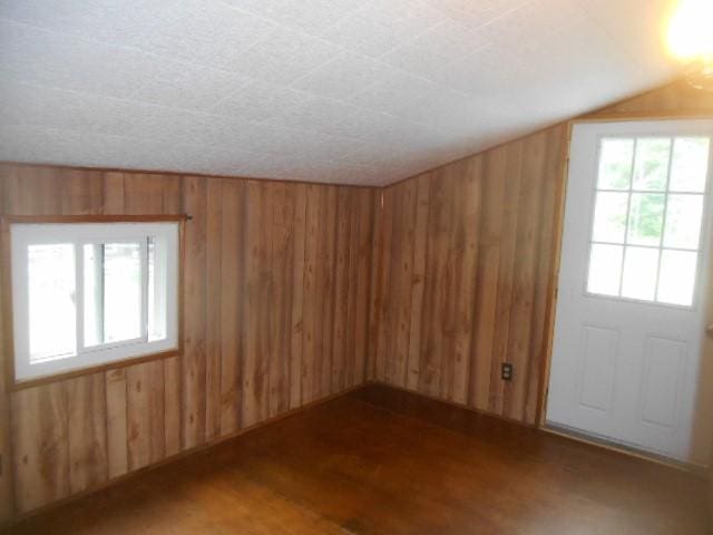 13615 W Ridge Rd, West Springfield, PA 16443 - unfurnished room with wood walls, wood finished floors, and vaulted ceiling