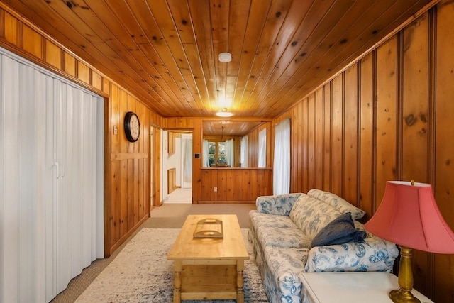 6750 W Ridge Rd, Fairview, PA 16415 - living room with wooden walls, wooden ceiling, and carpet floors