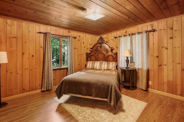 6750 W Ridge Rd, Fairview, PA 16415 - bedroom featuring wooden ceiling, wooden walls, and wood finished floors