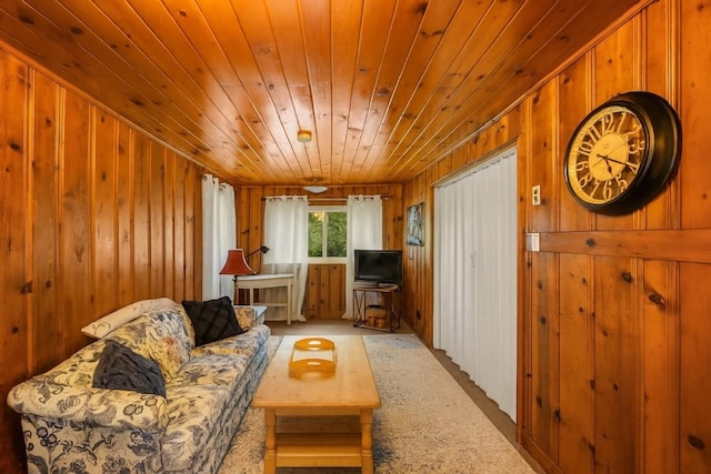 6750 W Ridge Rd, Fairview, PA 16415 - living room with wooden walls, wood ceiling, and light carpet