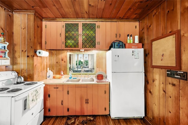 6750 W Ridge Rd, Fairview, PA 16415 - kitchen with white appliances, wood ceiling, light countertops, wooden walls, and dark wood-style flooring