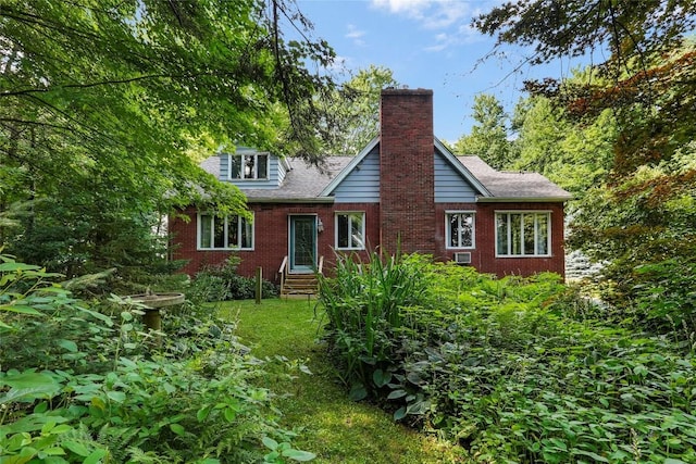 6750 W Ridge Rd, Fairview, PA 16415 - view of front facade featuring brick siding, a chimney, and roof with shingles