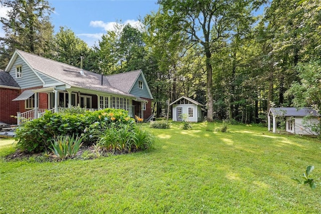 6750 W Ridge Rd, Fairview, PA 16415 - view of green lawn with an outbuilding